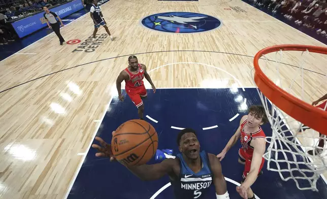 Minnesota Timberwolves guard Anthony Edwards (5) goes up for a shot during the first half of an NBA basketball game against the Chicago Bulls, Wednesday, Feb. 5, 2025, in Minneapolis. (AP Photo/Abbie Parr)