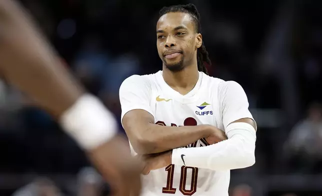 Cleveland Cavaliers guard Darius Garland (10) poses immediately after sinking a three-point shot at the buzzer to defeat the Detroit Pistons in an NBA basketball game, Wednesday, Feb. 5, 2025, in Detroit. (AP Photo/Duane Burleson)