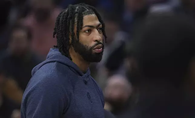 Dallas Mavericks' Anthony Davis walks the floor during a timeout in the first half of an NBA basketball game against the Philadelphia 76ers, Tuesday, Feb. 4, 2025, in Philadelphia. (AP Photo/Matt Slocum)