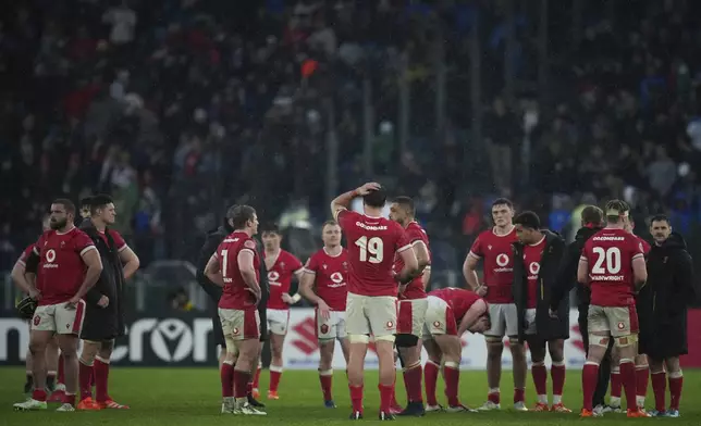 Wale's Teddy Williams, center, reacts after being defeated during the Six Nations rugby union match between Italy and Wales at the Olympic Stadium in Roma, Italy, Saturday, Feb. 8, 2025. (AP Photo/Alessandra Tarantino)