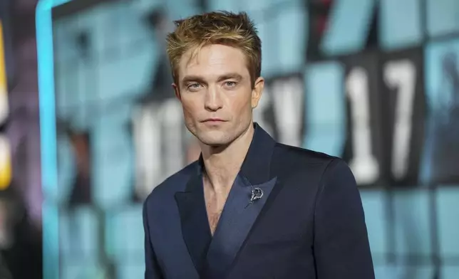 Robert Pattinson poses for photographers upon arrival at the World premiere for the film 'Mickey 17' on Thursday, Feb. 13, 2025, in London. (Photo by Scott A Garfitt/Invision/AP)