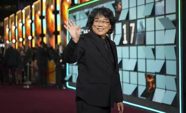 Director Bong Joon-Ho poses for photographers upon arrival at the World premiere for the film 'Mickey 17' on Thursday, Feb. 13, 2025, in London. (Photo by Scott A Garfitt/Invision/AP)