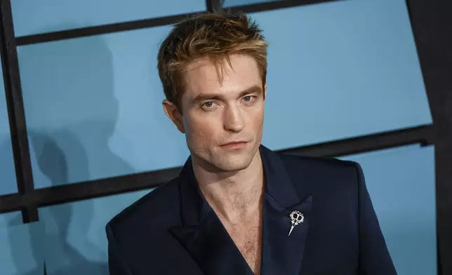Robert Pattinson poses for photographers upon arrival at the World premiere for the film 'Mickey 17' on Thursday, Feb. 13, 2025, in London. (Photo by Joel C Ryan/Invision/AP)