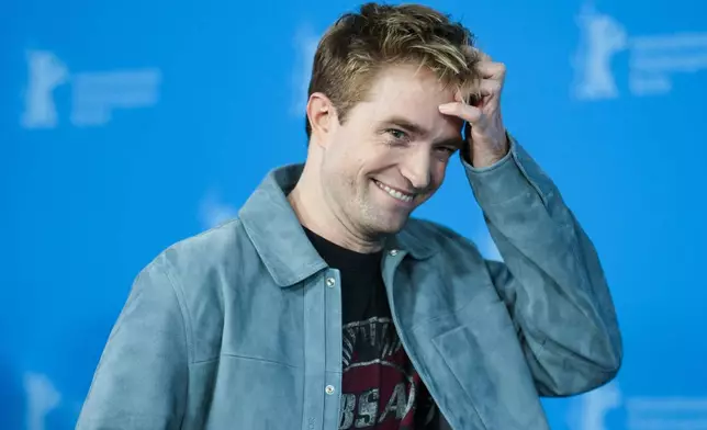 Robert Pattinson poses for photographer at the photo call for the film 'Mickey 17' at the International Film Festival, Berlinale, in Berlin, Saturday, Feb. 15, 2025. (AP Photo/Markus Schreiber)
