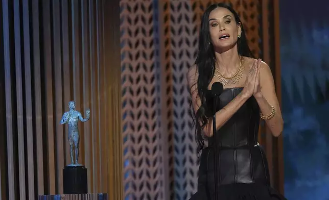 Demi Moore accepts the award for outstanding performance by a female actor in a leading role for "The Substance" during the 31st annual Screen Actors Guild Awards on Sunday, Feb. 23, 2025, at the Shrine Auditorium in Los Angeles. (AP Photo/Chris Pizzello)