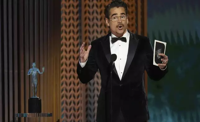 Colin Farrell accepts the award for outstanding performance by a male actor in a television movie or limited series for "The Penguin" during the 31st annual Screen Actors Guild Awards on Sunday, Feb. 23, 2025, at the Shrine Auditorium in Los Angeles. (AP Photo/Chris Pizzello)