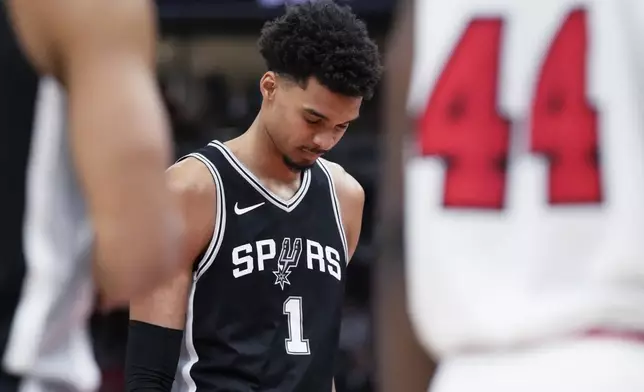 FILE - San Antonio Spurs center Victor Wembanyama reacts after a missed a free throw during the second half of an NBA basketball game against the Chicago Bulls in Chicago, Monday, Jan. 6, 2025. (AP Photo/Nam Y. Huh, File)