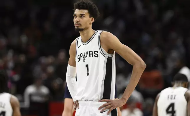 FILE - San Antonio Spurs center Victor Wembanyama (1) looks oon during the second half of an NBA basketball game against the Washington Wizards, Monday, Feb. 10, 2025, in Washington. (AP Photo/Nick Wass, File)