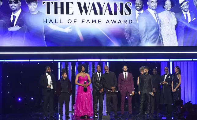 Craig Wayans, from left, Chaunté Wayans, Kim Wayans, Marlon Wayans, Damon Wayans Sr., Damon Wayans Jr., and Damien Dante Wayans are given the NAACP Hall of Fame award during the 56th NAACP Image Awards on Saturday, Feb. 22, 2025, in Pasadena, Calif. (Photo by Richard Shotwell/Invision/AP)