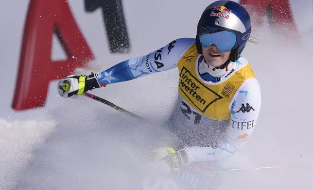 United States' Lindsey Vonn arrives at the finish area of a women's downhill race, at the Alpine Ski World Championships, in Saalbach-Hinterglemm, Austria, Saturday, Feb. 8, 2025. (AP Photo/Giovanni Auletta)