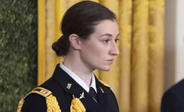 FILE - Army Capt. Rebecca M. Lobach, of Durham, N.C., is pictured during the Presidential Medal of Freedom ceremony in the East Room of the White House, Jan. 4, 2025, in Washington. (AP Photo/Manuel Balce Ceneta, File)