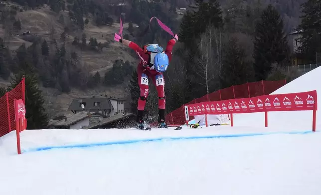 Switzerland's Robin Bussard competes during the men's mixed relay race at the Ski Mountaineering World Cup event in Bormio, Italy, Sunday, Feb. 23, 2025. (AP Photo/Antonio Calanni)