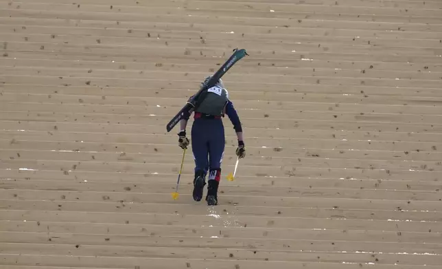 France's Louna Dupont competes during the women's mixed relay race at the Ski Mountaineering World Cup event in Bormio, Italy, Sunday, Feb. 23, 2025. (AP Photo/Antonio Calanni)