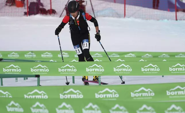 China's Suolangquzhen competes during the women's mixed relay race at the Ski Mountaineering World Cup event in Bormio, Italy, Sunday, Feb. 23, 2025. (AP Photo/Antonio Calanni)