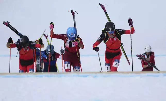 Athletes compete during the men's sprint race at the Ski Mountaineering World Cup event in Bormio, Italy, Saturday, Feb. 22, 2025. (AP Photo/Antonio Calanni)