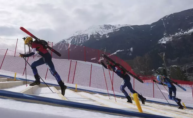 Athletes compete during the men's sprint race at the Ski Mountaineering World Cup event in Bormio, Italy, Saturday, Feb. 22, 2025. (AP Photo/Antonio Calanni)