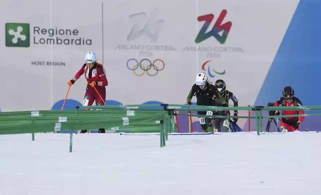 Athletes compete during the women's sprint race at the Ski Mountaineering World Cup event in Bormio, Italy, Saturday, Feb. 22, 2025. (AP Photo/Antonio Calanni)