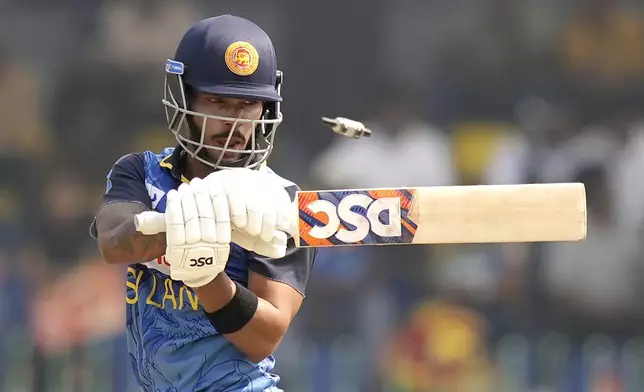 Sri Lanka's Pathum Nissanka reacts after being bowled out by Australia's Aaron Hardie during the second ODI cricket match between Sri Lanka and Australia in Colombo, Sri Lanka, Friday, Feb. 14, 2025. (AP Photo/Eranga Jayawardena)