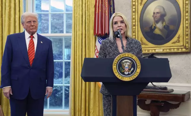Attorney General Pam Bondi speaks after being sworn in by Supreme Court Associate Justice Clarence Thomas, in the Oval Office of the White House, Wednesday, Feb. 5, 2025, in Washington, as President Donald Trump looks on. (AP Photo/Evan Vucci)