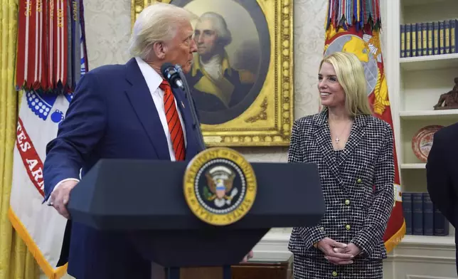 President Donald Trump welcomes Pam Bondi before she is sworn in as Attorney General by Supreme Court Associate Justice Clarence Thomas, in the Oval Office of the White House, Wednesday, Feb. 5, 2025, in Washington. (AP Photo/Evan Vucci)