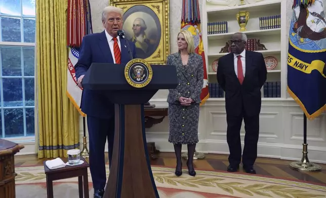 President Donald Trump welcomes Pam Bondi before she is sworn in as Attorney General by Supreme Court Associate Justice Clarence Thomas, right, in the Oval Office of the White House, Wednesday, Feb. 5, 2025, in Washington. (AP Photo/Evan Vucci)
