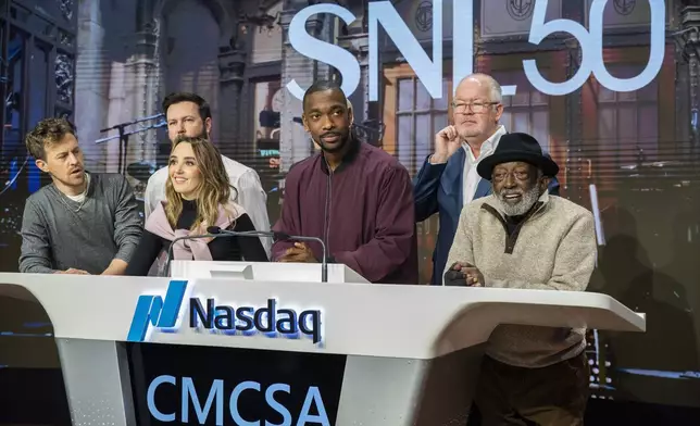 Mark Marshall, second right, chairman of Global Advertising &amp; Partnerships, NBCUniversal, and current and veteran members of the SNL cast, celebrate SNL as they ring the Nasdaq opening bell, in New York's Times Square, Friday, Feb. 14, 2025. (AP Photo/Eduardo Munoz Alvarez)