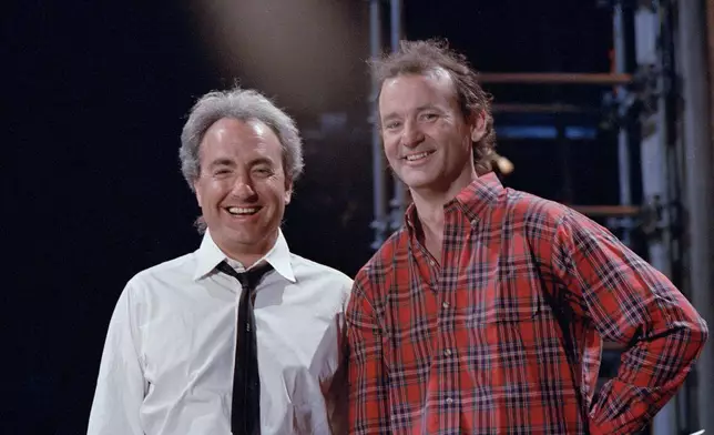 FILE - "Saturday Night Live" host Bill Murray, a former cast member, is pictured with producer Lorne Michaels, left, during rehearsals on March 19, 1987, in New York. (AP Photo/G. Paul Burnett, File)