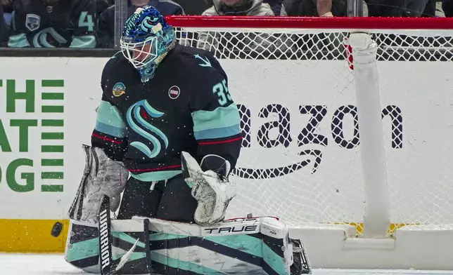 FILE - Seattle Kraken goaltender Joey Daccord makes a save during an NHL hockey game, Jan. 18, 2025, in Seattle. (AP Photo/Lindsey Wasson)