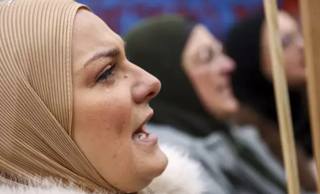 Woman cries and shouts during a protest following flash floods and landslides that killed 19 people more than four months ago, in Sarajevo, Bosnia, Monday, Feb. 10, 2025. (AP Photo/Armin Durgut)