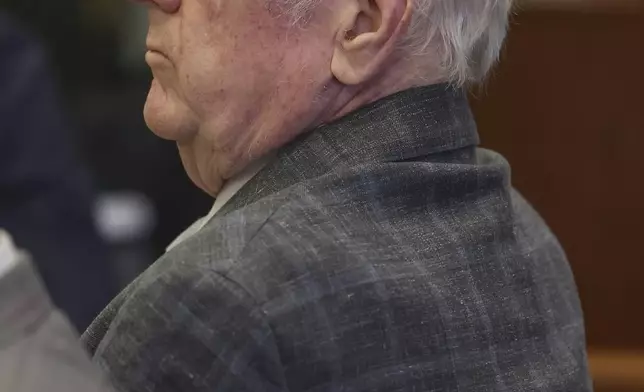 Jeffrey Ferguson, an Orange County Superior Court judge, who allegedly pulled a gun from his ankle holster and fatally shot his wife, stands on trial during opening statements at the Santa Ana Courthouse in Santa Ana, Calif., on Wednesday, Feb. 19, 2025. (Frederick M. Brown/Pool Photo via AP)