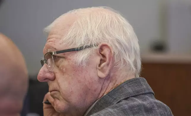 Jeffrey Ferguson, an Orange County Superior Court judge, who allegedly pulled a gun from his ankle holster and fatally shot his wife, stands on trial during opening statements at the Santa Ana Courthouse in Santa Ana, Calif., on Wednesday, Feb. 19, 2025. (Frederick M. Brown/Pool Photo via AP)