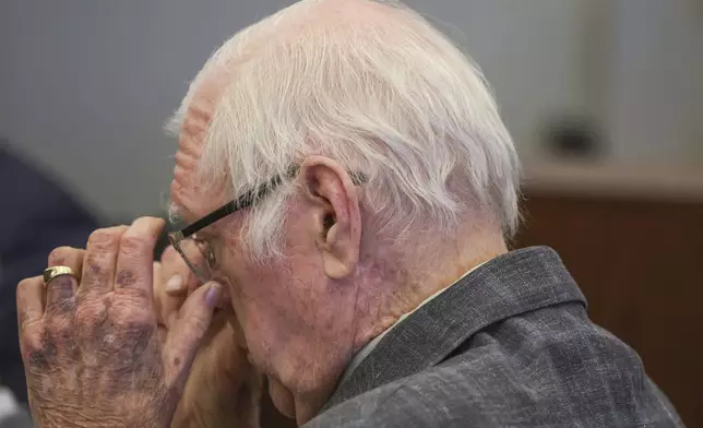 Jeffrey Ferguson, an Orange County Superior Court judge, who allegedly pulled a gun from his ankle holster and fatally shot his wife, stands on trial during opening statements at the Santa Ana Courthouse in Santa Ana, Calif., on Wednesday, Feb. 19, 2025. (Frederick M. Brown/Pool Photo via AP)