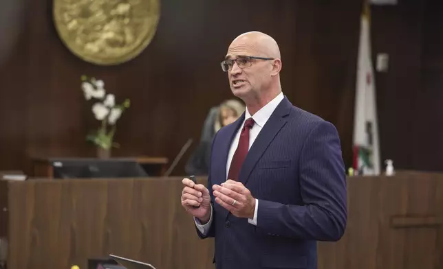 Senior Deputy District Attorney, Seton Hunt, Seton Hunt presents his opening statements in the prosecution of Jeffrey Ferguson, an Orange County Superior Court judge, who allegedly pulled a gun from his ankle holster and fatally shot his wife, at the Santa Ana Courthouse in Santa Ana, Calif., on Wednesday, Feb. 19, 2025. (Frederick M. Brown/Pool Photo via AP)