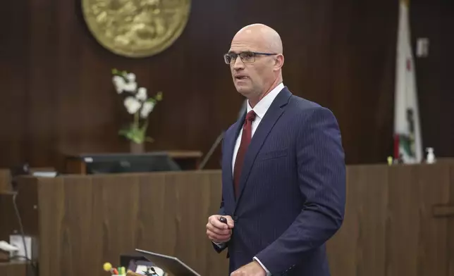 Senior Deputy District Attorney, Seton Hunt, Seton Hunt presents his opening statements in the prosecution of Jeffrey Ferguson, an Orange County Superior Court judge, who allegedly pulled a gun from his ankle holster and fatally shot his wife, at the Santa Ana Courthouse in Santa Ana, Calif., on Wednesday, Feb. 19, 2025. (Frederick M. Brown/Pool Photo via AP)