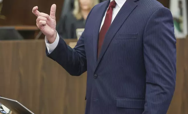 Senior Deputy District Attorney, Seton Hunt, Seton Hunt presents his opening statements in the prosecution of Jeffrey Ferguson, an Orange County Superior Court judge, who allegedly pulled a gun from his ankle holster and fatally shot his wife, at the Santa Ana Courthouse in Santa Ana, Calif., on Wednesday, Feb. 19, 2025. (Frederick M. Brown/Pool Photo via AP)