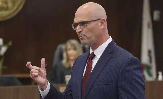 Senior Deputy District Attorney, Seton Hunt presents his opening statements in the prosecution of Jeffrey Ferguson, an Orange County Superior Court judge, who allegedly pulled a gun from his ankle holster and fatally shot his wife, at the Santa Ana Courthouse in Santa Ana, Calif., on Wednesday, Feb. 19, 2025. (Frederick M. Brown/Pool Photo via AP, Pool)