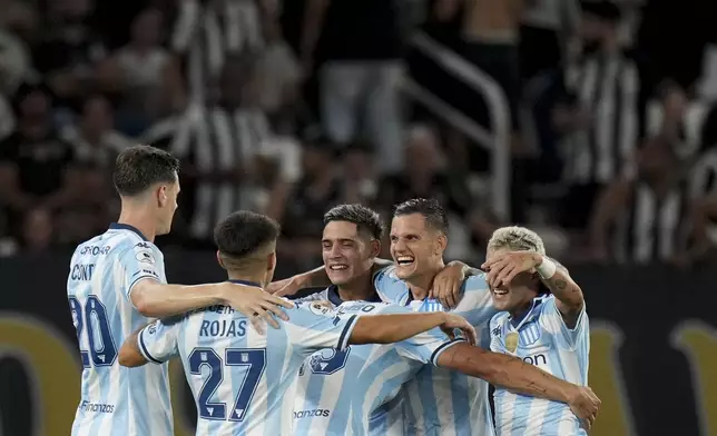 Bruno Zuculini of Argentina's Racing Club, second from right, celebrates scoring his side's second goal against Brazil's Botafogo with teammates during the second leg of the Recopa Sudamericana final soccer match in Rio de Janeiro, Thursday, Feb. 27, 2025. (AP Photo/Silvia Izquierdo)