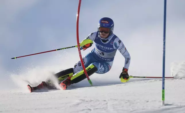 United States' Mikaela Shiffrin competes in a women's slalom, at the Alpine Ski World Championships, in Saalbach-Hinterglemm, Austria, Saturday, Feb. 15, 2025. (AP Photo/Marco Trovati)