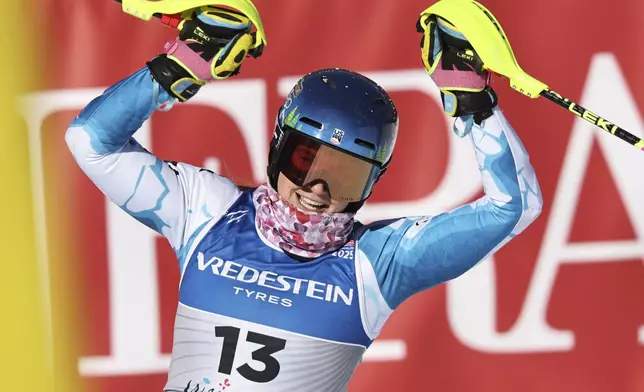 United States' Paula Moltzan celebrates at the finish area of a women's slalom, at the Alpine Ski World Championships, in Saalbach-Hinterglemm, Austria, Saturday, Feb. 15, 2025. (AP Photo/Marco Trovati)