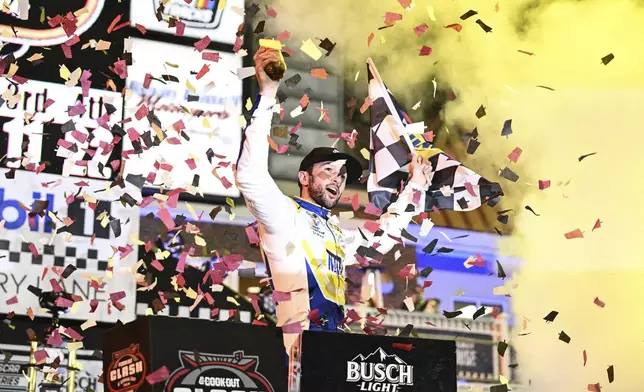 Chase Elliott celebrates in Victory Lane after winning a NASCAR Cup Series auto race at Bowman Gray Stadium, Sunday, Feb. 2, 2025, in Winston-Salem, N.C. (AP Photo/Matt Kelley)