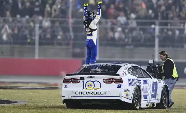 Chase Elliott celebrates after winning a NASCAR Cup Series auto race at Bowman Gray Stadium, Sunday, Feb. 2, 2025, in Winston-Salem, N.C. (AP Photo/Matt Kelley)