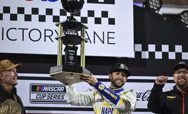 Chase Elliott, center, celebrates in Victory Lane after winning a NASCAR Cup Series auto race at Bowman Gray Stadium, Sunday, Feb. 2, 2025, in Winston-Salem, N.C. (AP Photo/Matt Kelley)