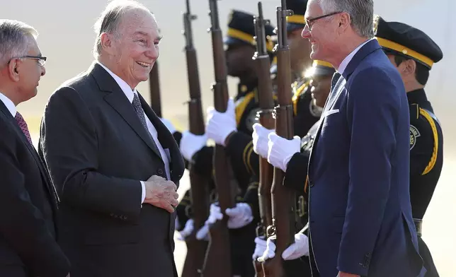 FILE - Lt. Governor Casey Cagle welcomes His Highness the Aga Khan, the 49th hereditary Imam (spiritual leader) of the world's Shia Ismaili Muslim Community, as he arrives at Fulton County Airport to celebrate with his Georgia followers his 60th anniversary as their leader Tuesday, March 13, 2018, in Atlanta. (Curtis Compton/Atlanta Journal-Constitution via AP)
