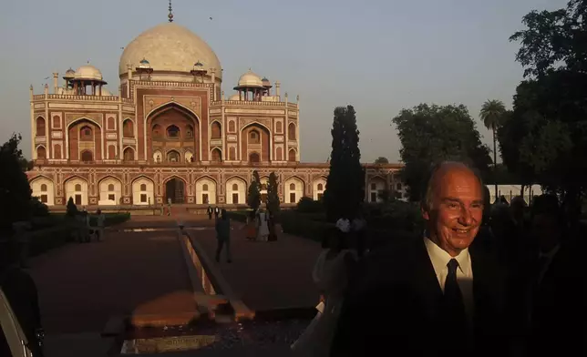 FILE - The Aga Khan, spiritual head of Ismaili Muslims, leaves after the inauguration of the restored 16th century Humayun's Tomb in New Delhi, India, Wednesday, Sept. 18, 2013. (AP Photo/Manish Swarup, File)