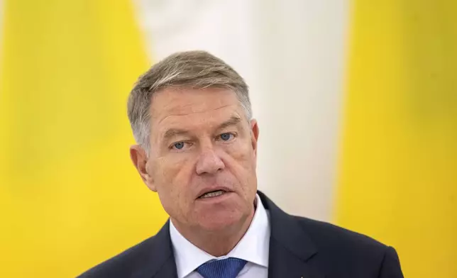 FILE - Romania's President Klaus Iohannis speaks during a joint media conference with Lithuanian President Gitanas Nauseda at the President's palace in Vilnius, Lithuania, Thursday, Nov. 24, 2022. (AP Photo/Mindaugas Kulbis, File)
