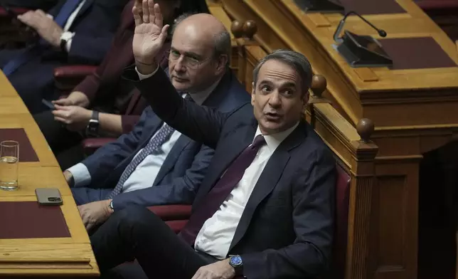 Greece's Prime Minister Kyriakos Mitsotakis votes for the election of former Parliament Speaker Constantine Tassoulas as Greece's new president at the Parliament, in Athens, Greece, Wednesday, Feb. 12, 2025. (AP Photo/Thanassis Stavrakis)