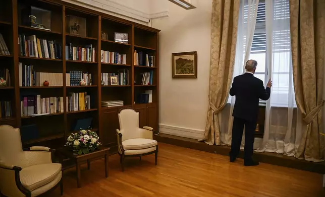 Newly elected President of Parliament, Constantine Tassoulas waits to receive the results of the fourth round of voting at the parliament in Athens, Greece, Wednesday, Feb. 12, 2025. (Angelos Tzortzinis/Pool Photo via AP)