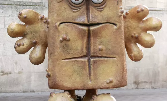 FILE - The statue "Bernd das Brot" stand in front of the City hall in Erfurt, Germany, on Wednesday, Feb. 4, 2009. (AP Photo/Jens Meyer, File)
