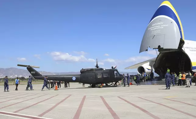 U.N backed Salvador police force unloads a helicopter carrying material for the Multinational Security Support (MSS) mission after the arrival of a Kenyan police contingent, at the Toussaint Louverture International Airport in Port-au-Prince, Haiti, Thursday, Feb. 6, 2025. (AP Photo/Odelyn Joseph)