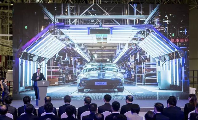 FILE - In this photo released by China's Xinhua News Agency, Tesla CEO Elon Musk speaks at a delivery ceremony for the first Tesla Model 3 cars made at Tesla's Shanghai factory in Shanghai, Tuesday, Jan. 7, 2020. (Ding Ting/Xinhua via AP, File)